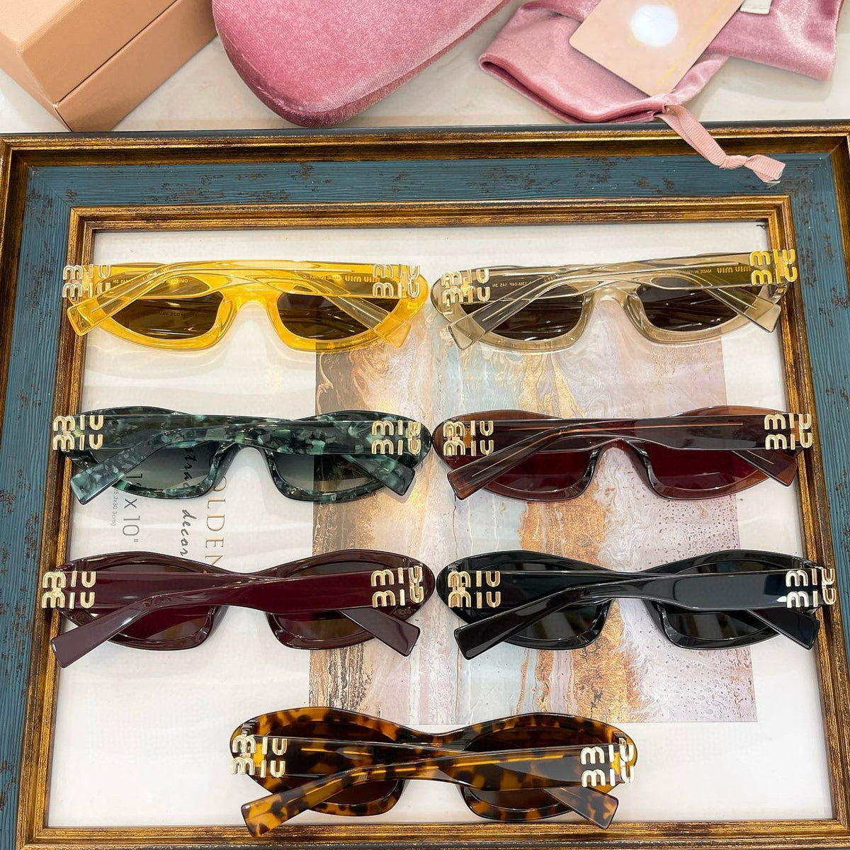 MIU M SUNGLASSES