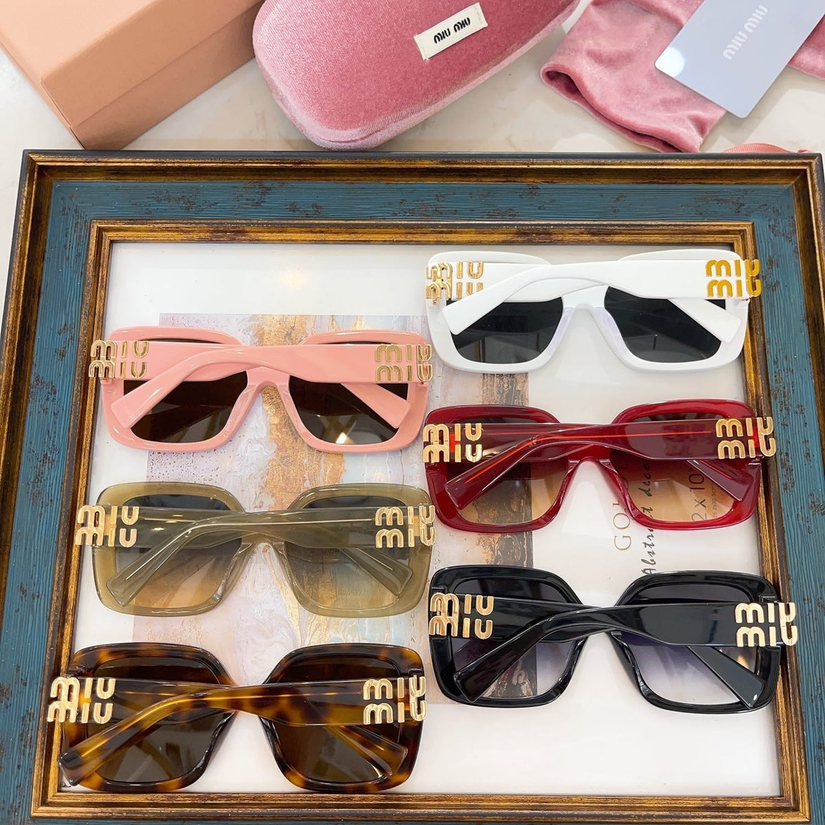 MIU M SUNGLASSES