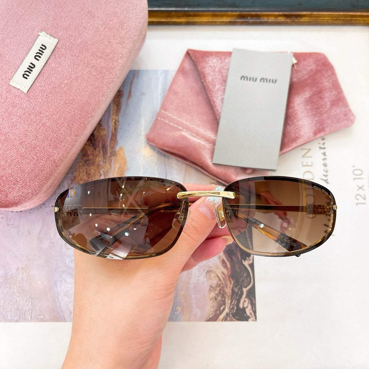 MIU M SUNGLASSES