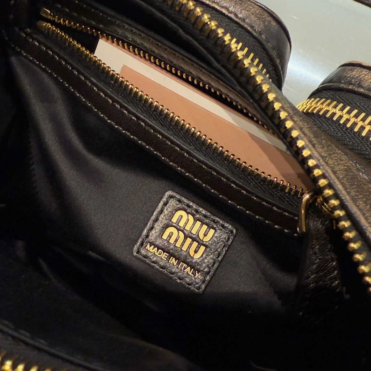 MIU M POCKET NAPPA LEATHER BAG