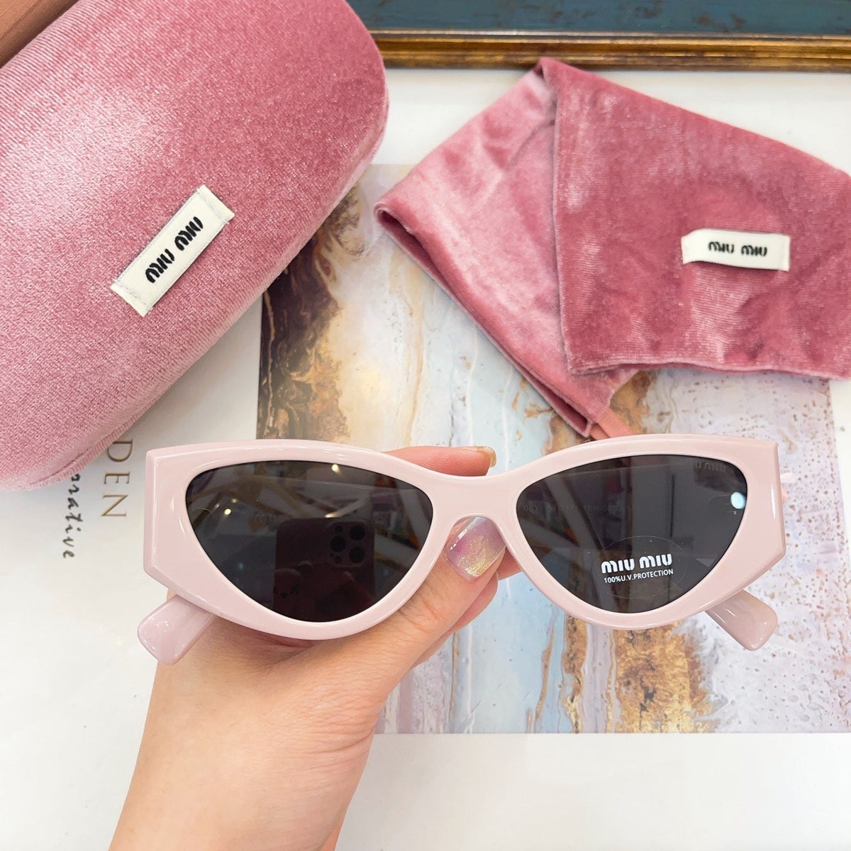 MIU M SUNGLASSES