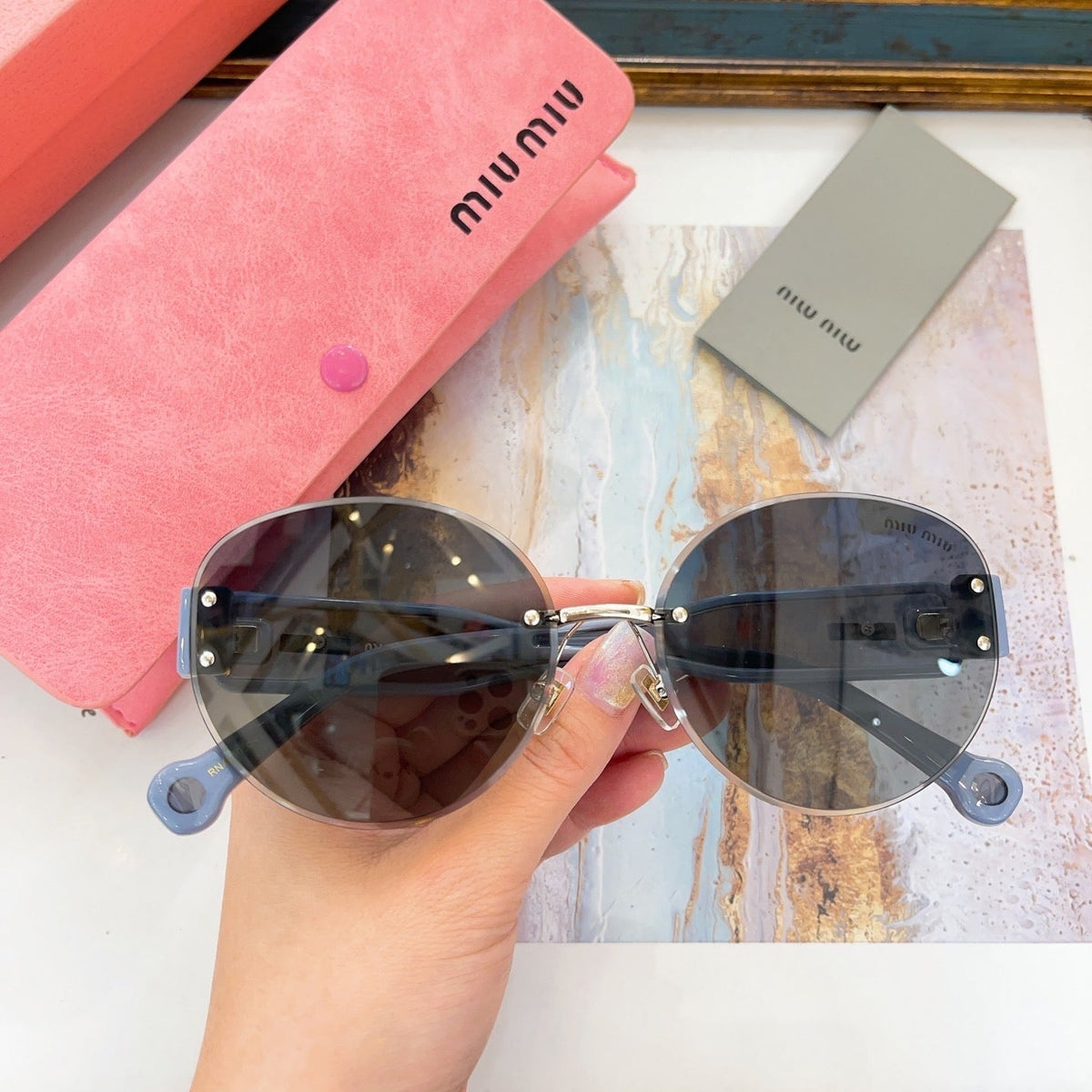 MIU M SUNGLASSES