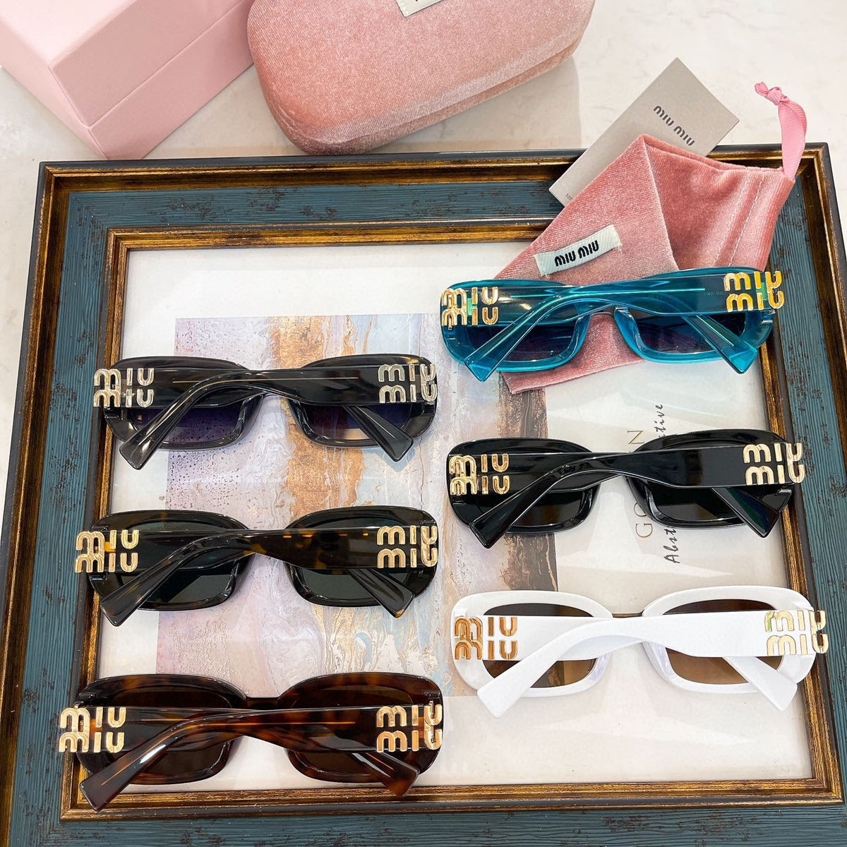 MIU M SUNGLASSES