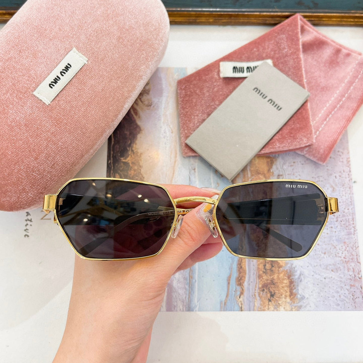 MIU M SUNGLASSES