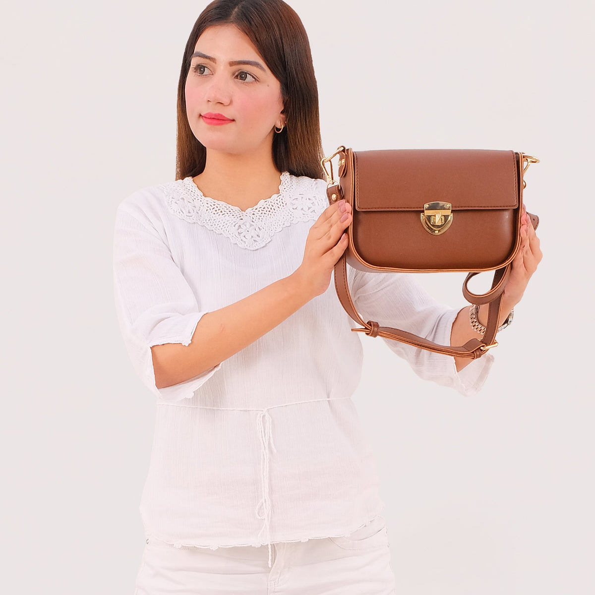 Brown saddle bag with twist lock