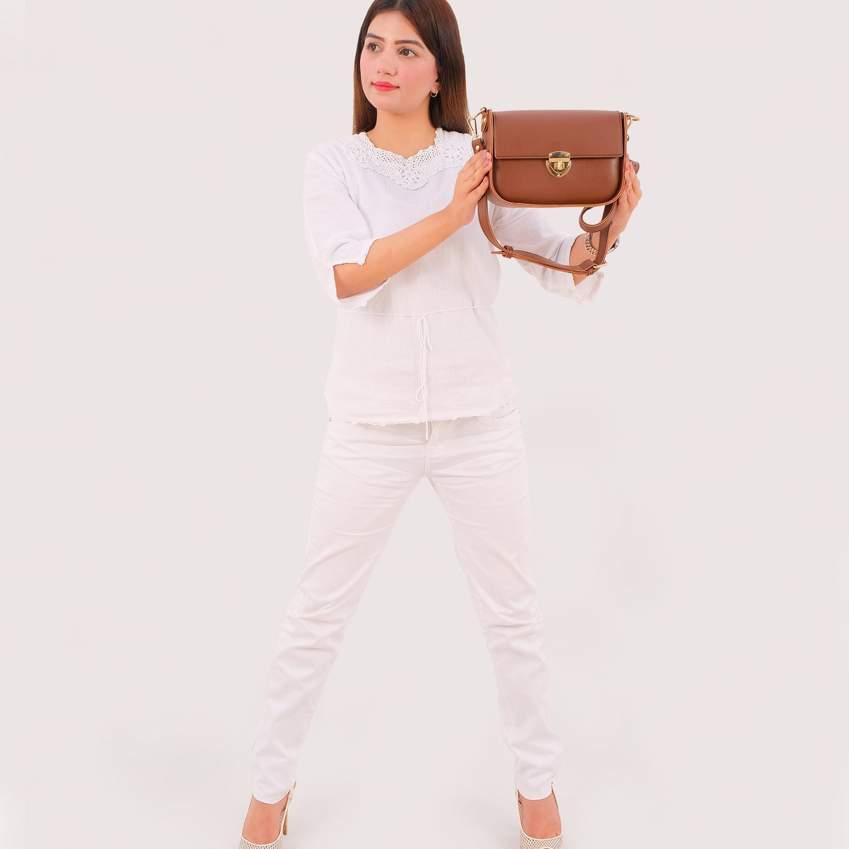 Brown saddle bag with twist lock