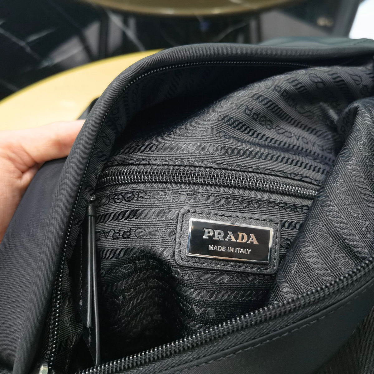 PD RE-NYLON AND LEATHER BACKPACK