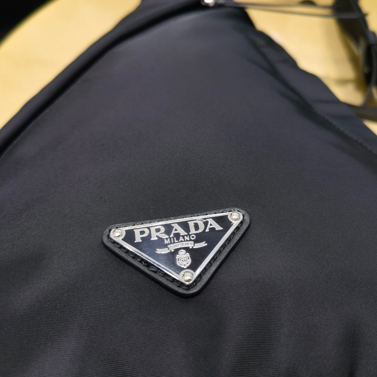 PD RE-NYLON AND LEATHER BACKPACK