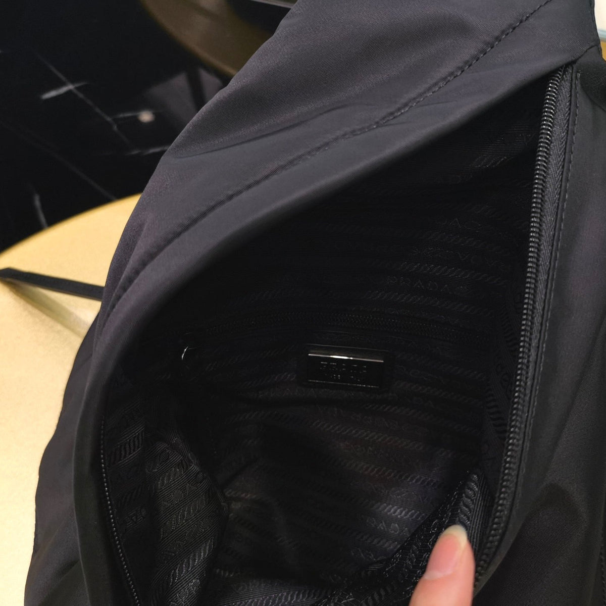 PD RE-NYLON AND LEATHER BACKPACK